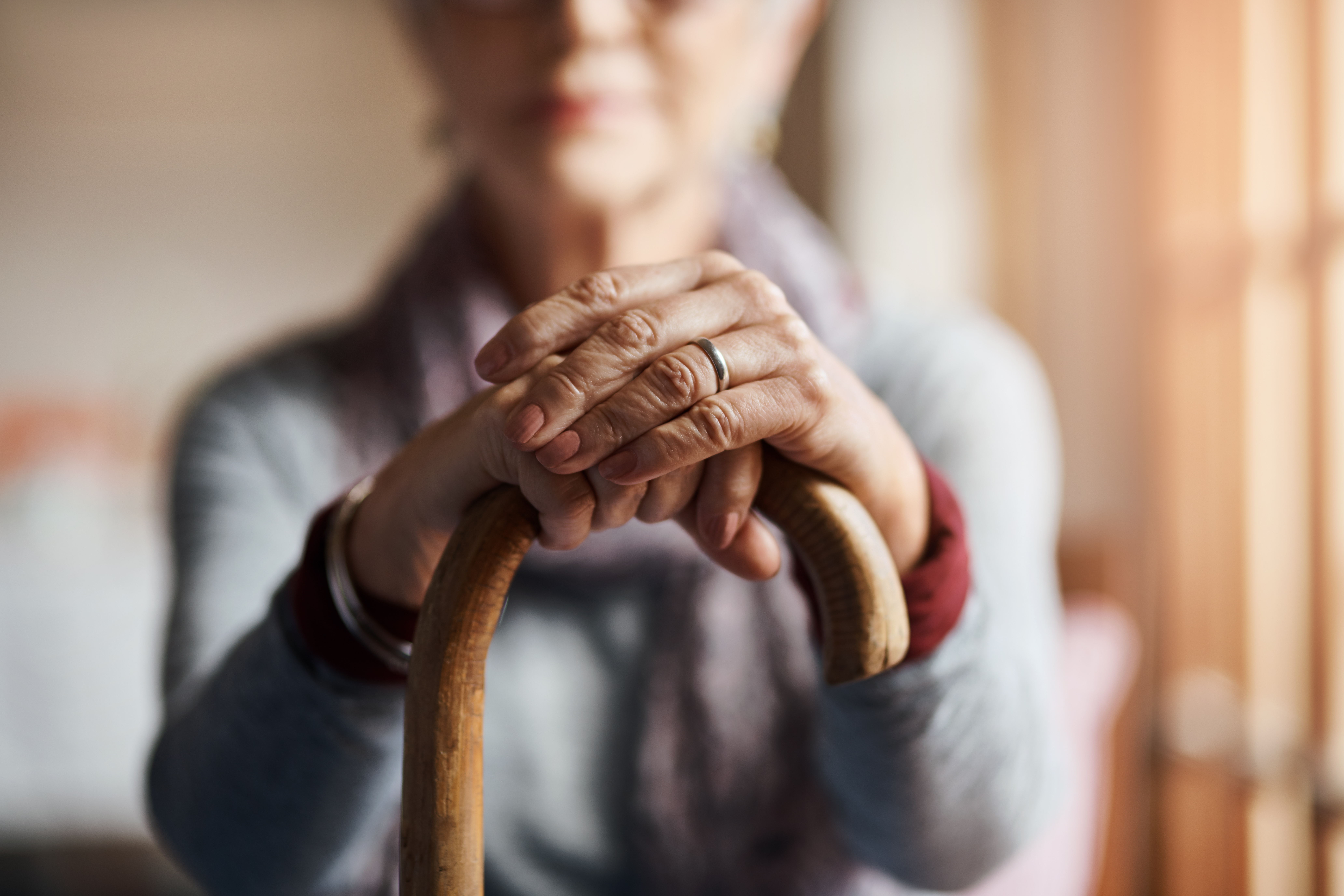 old woman holding cane