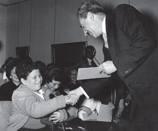 Young Itzhak Perlman receiving the Sharett Scholarship, which provides tuition assistance to young students in Israel.