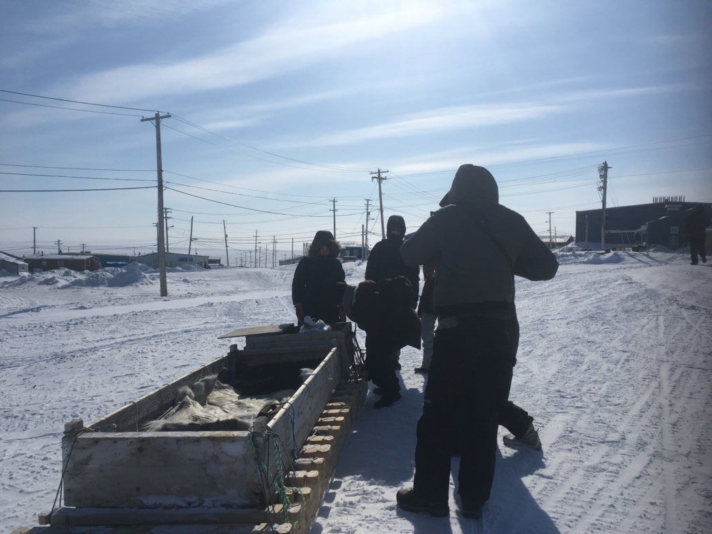 Carleton students work with a sledge in Iglulik, Nunavut as part of the Azrieli Global Studio.