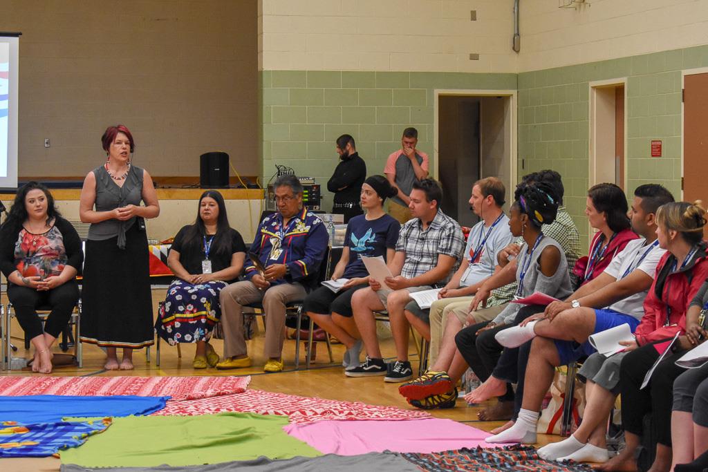 Teach for Canada high school teachers do a blanket exercise.