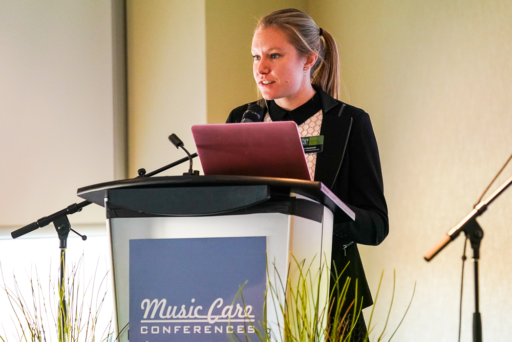Chelsea Mackinnon, education and research lead, presenting at a music care conference in the UK.
