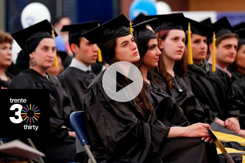 Graduate students of the Azrieli Graduate School at Yeshiva University celebrate finding this stage of their education.