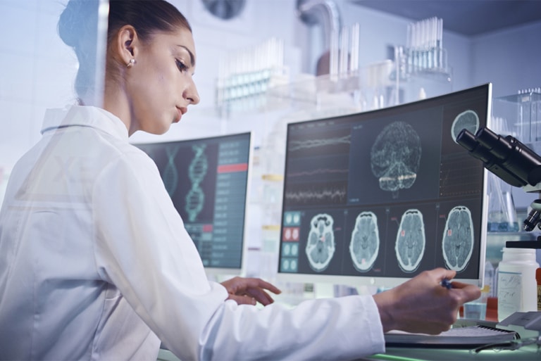 Researcher reviewing brain scans