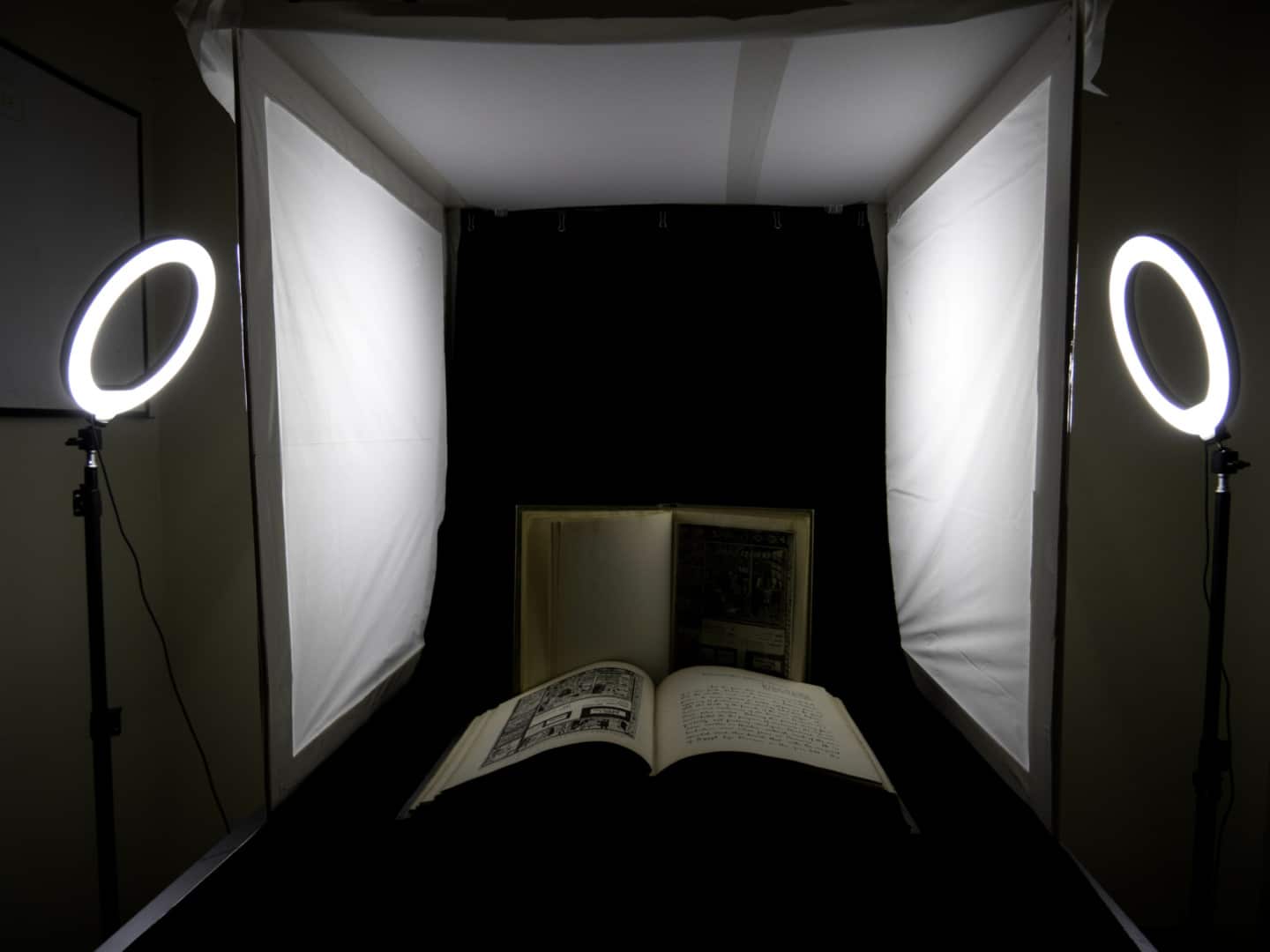 An open book inside a lightbox.